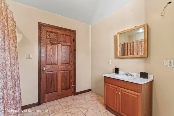 a white toilet sitting next to a bathroom sink