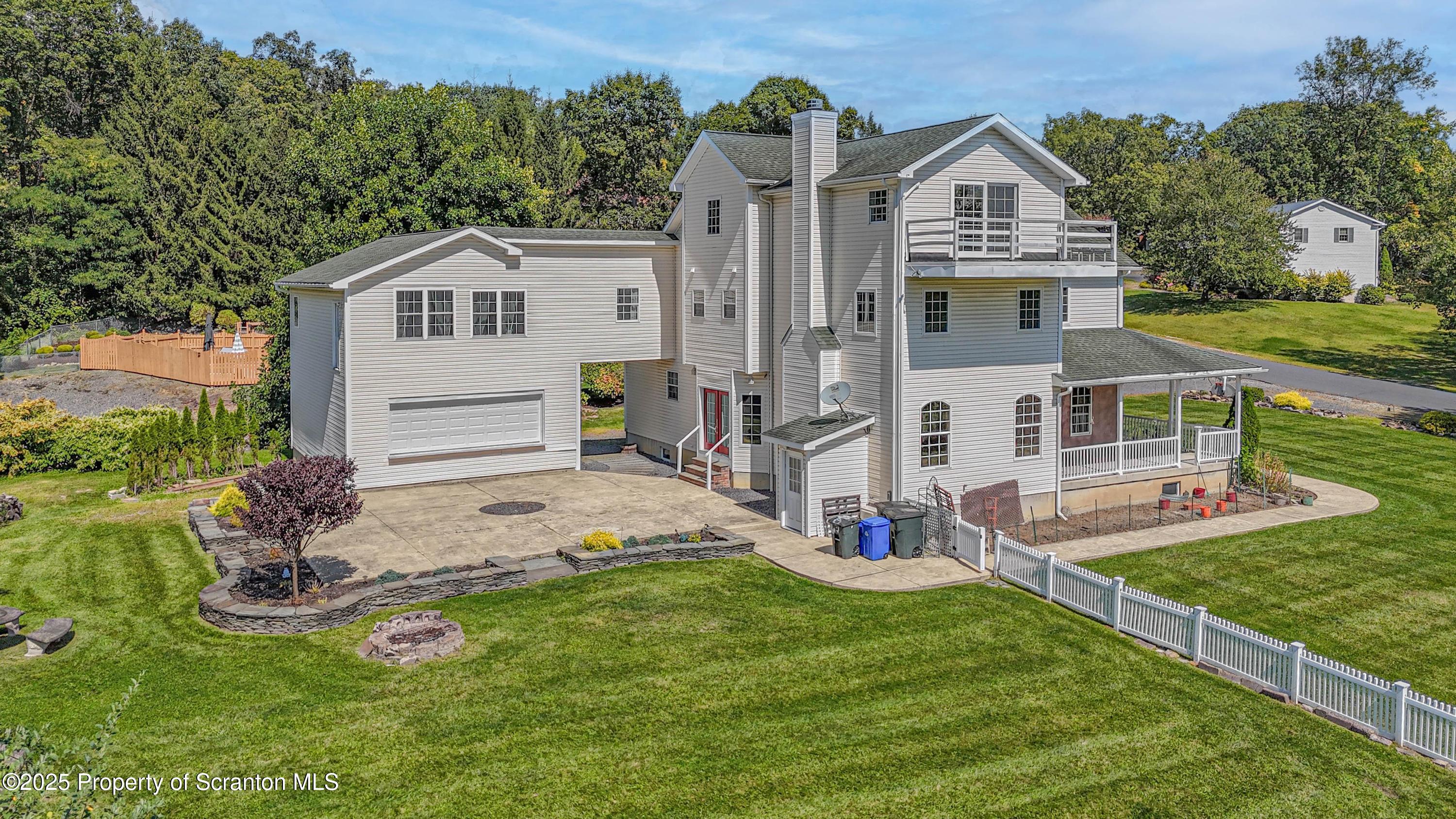 107 Ridgeview Drive Scranton, PA 18504 - Photo 3 of 48 a front view of a house with a yard and garage