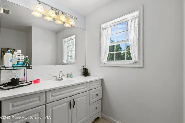 a view of a ceiling fan in a room