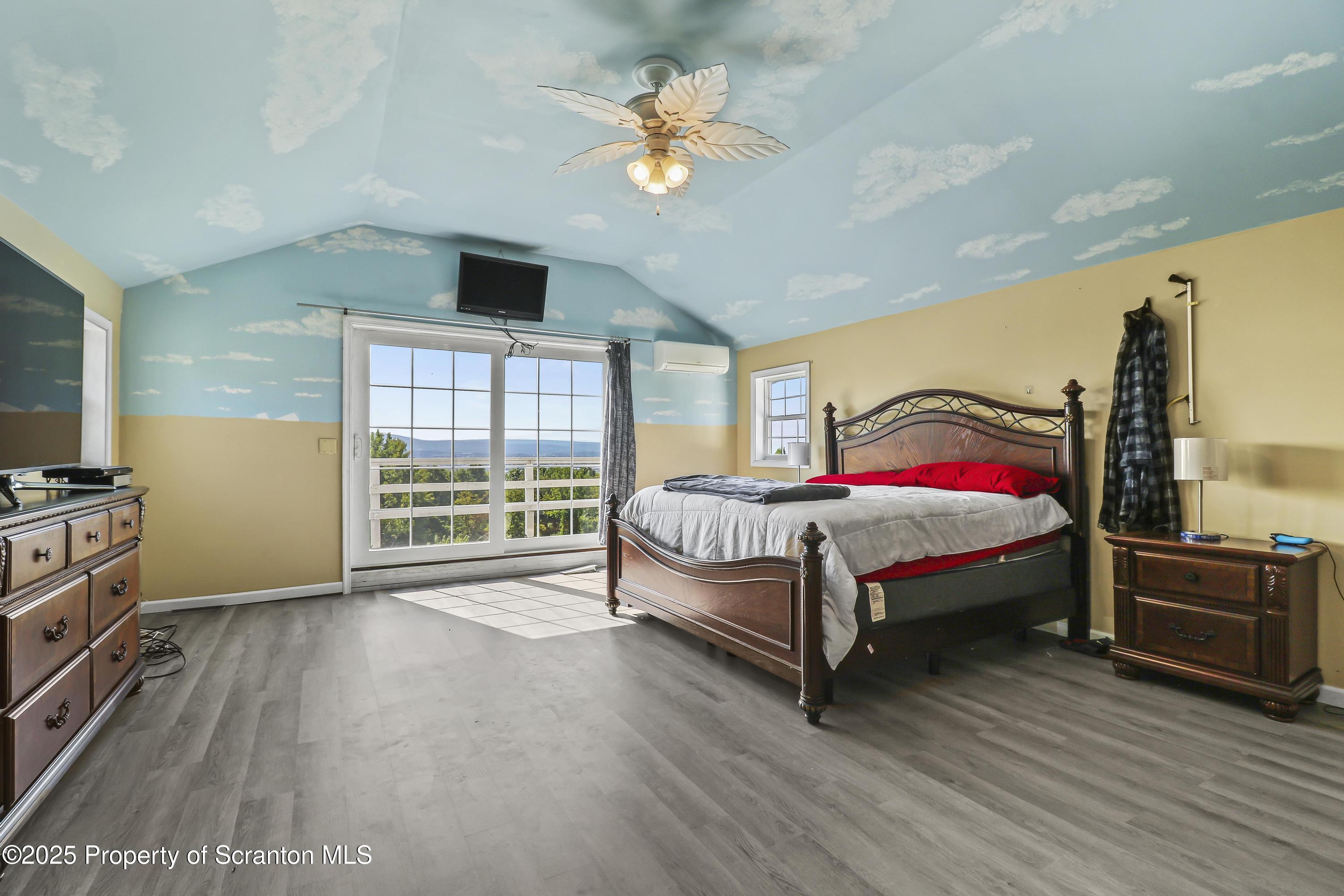 107 Ridgeview Drive Scranton, PA 18504 - Photo 36 of 48 a bedroom with a bed and a flat tv screen on dresser