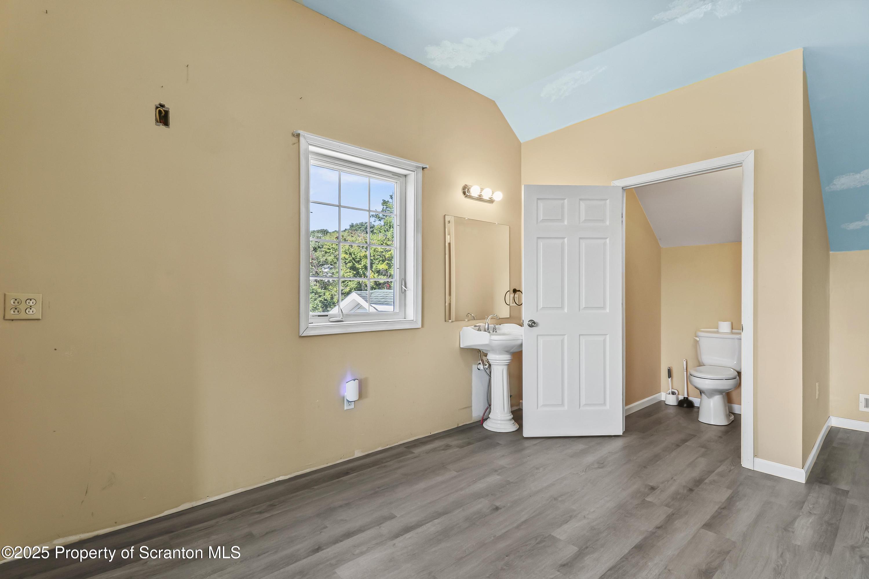 107 Ridgeview Drive Scranton, PA 18504 - Photo 39 of 48 a view of a room with wooden floor and a bathroom