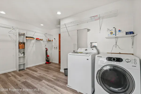 a living room with furniture window and wooden floor
