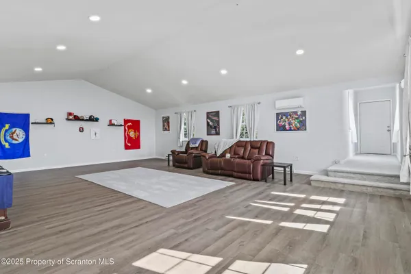 a view of empty room with wooden ceiling