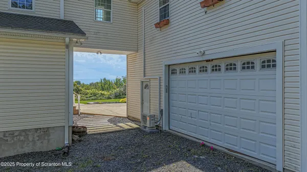 a view of front door and potted plants