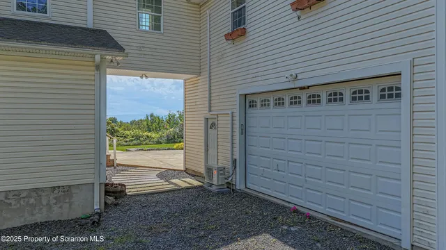 a view of front door and potted plants
