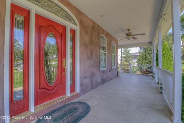 a view of a entryway door with furniture