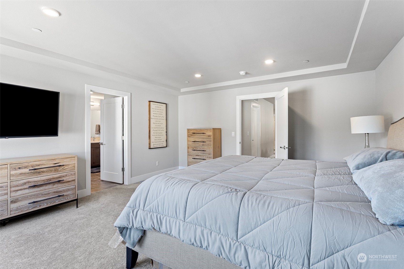 2124 229th Place Southwest Bothell, WA 98021 - Photo 13 of 37 a spacious bedroom with a bed and a flat screen tv