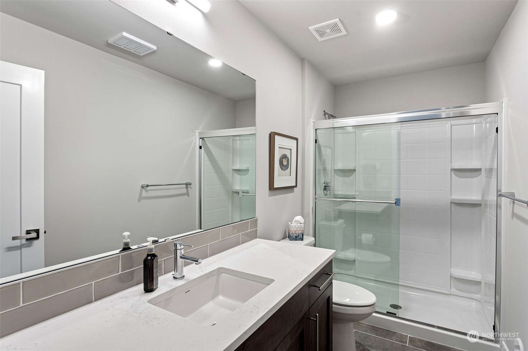 2124 229th Place Southwest Bothell, WA 98021 - Photo 22 of 37 a bathroom with a sink toilet and shower