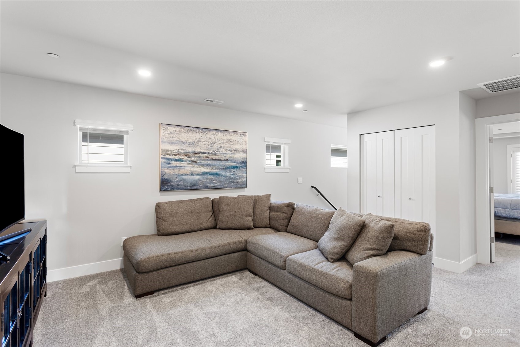 2124 229th Place Southwest Bothell, WA 98021 - Photo 28 of 37 a living room with furniture and a flat screen tv