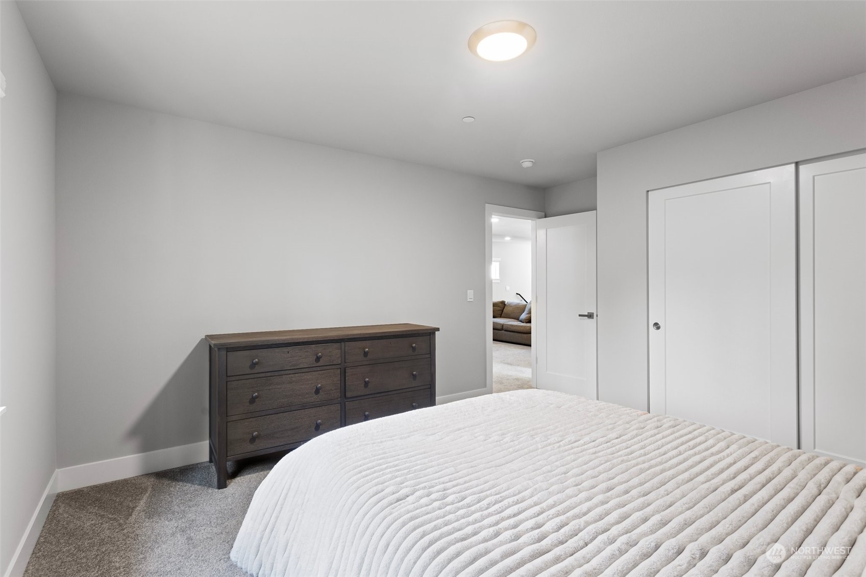2124 229th Place Southwest Bothell, WA 98021 - Photo 30 of 37 a bedroom with a bed and a dresser