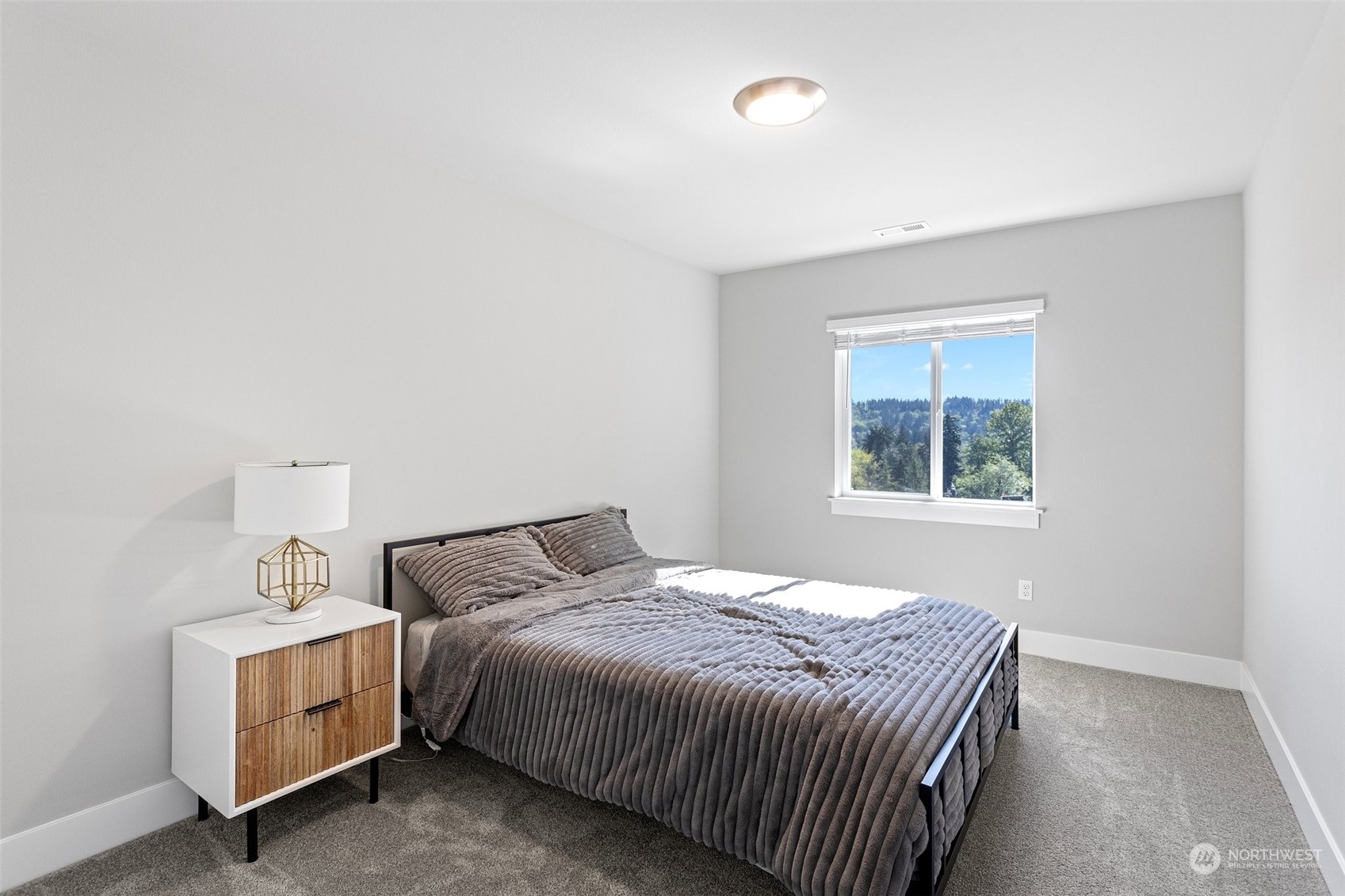 2124 229th Place Southwest Bothell, WA 98021 - Photo 31 of 37 a bedroom with a bed and window