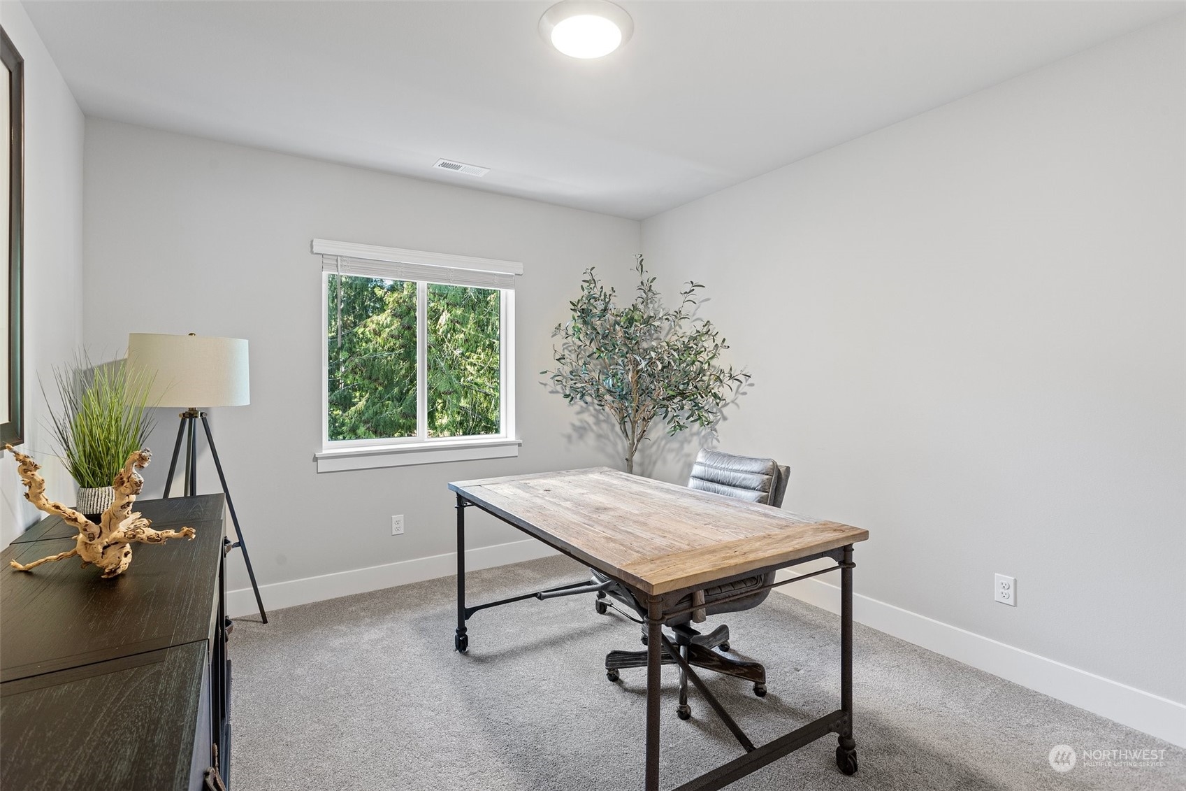2124 229th Place Southwest Bothell, WA 98021 - Photo 33 of 37 a view of a workspace with furniture and a window