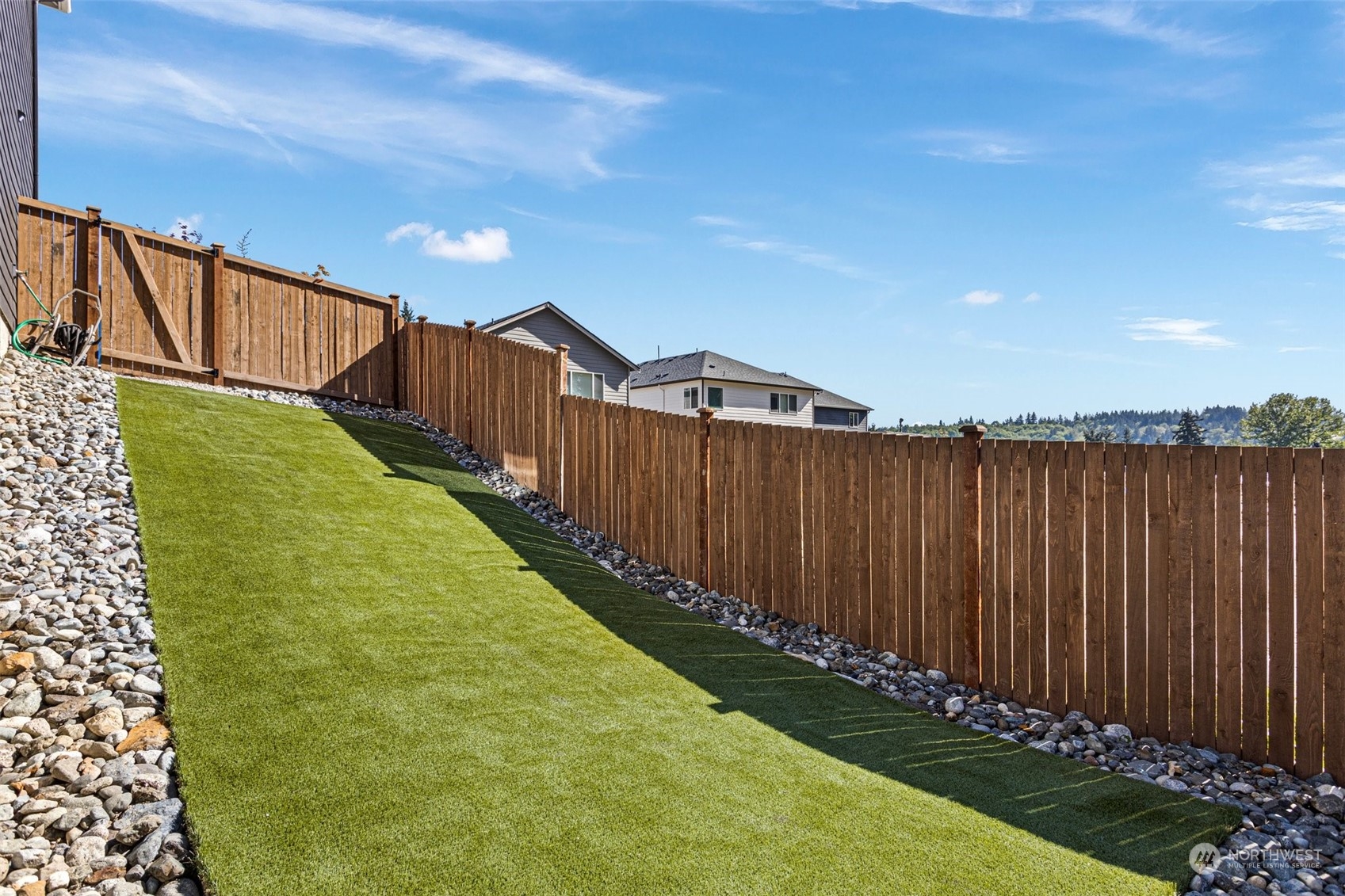 2124 229th Place Southwest Bothell, WA 98021 - Photo 36 of 37 a view of a backyard with wooden fence