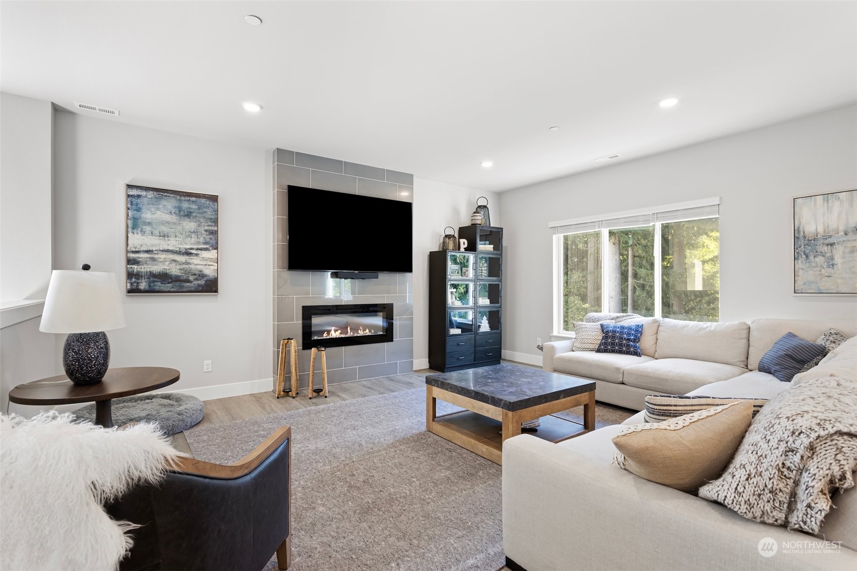 2124 229th Place Southwest Bothell, WA 98021 - Photo 4 of 37 a living room with furniture and a flat screen tv