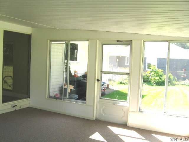8 Standish Road Lockport City, NY 14094 - Photo 8 of 16 Other. 3 season room opens to the fully fenced ba