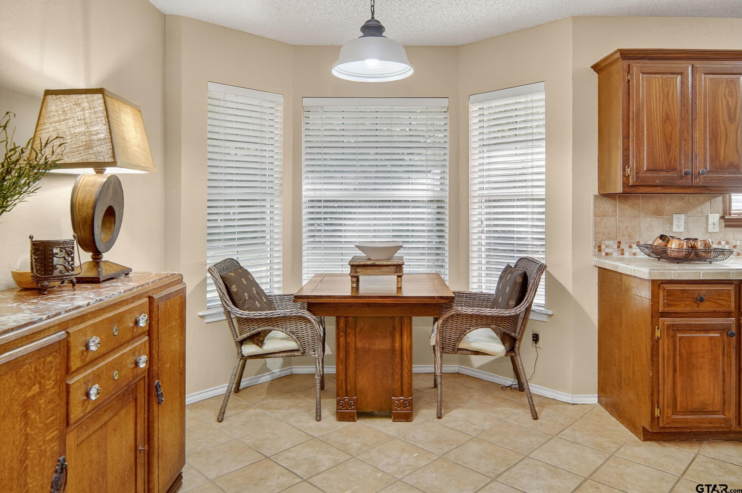 810 Jeanell Street Quitman, TX 75783 - Photo 13 of 37 a view of a workspace with furniture and a window