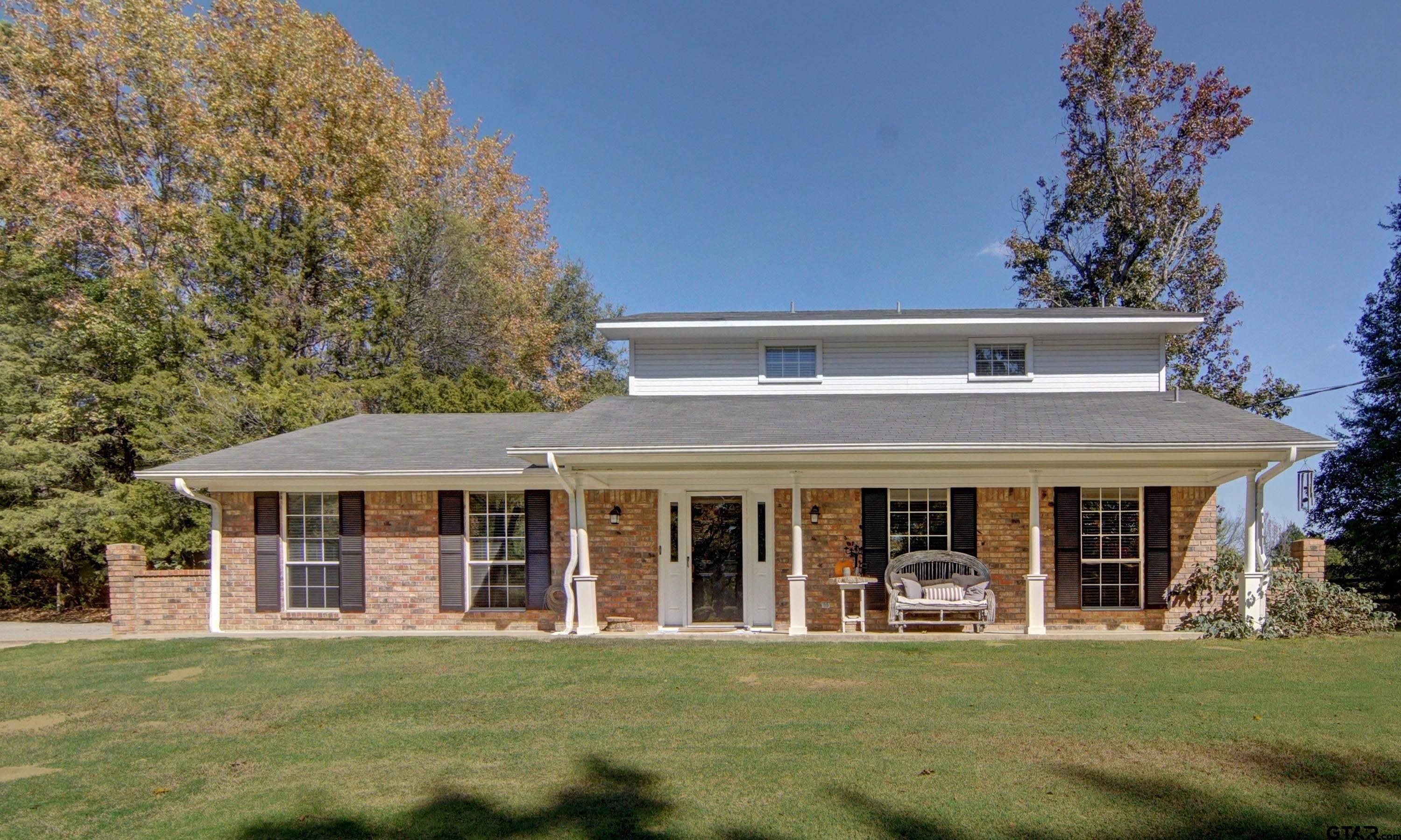 810 Jeanell Street Quitman, TX 75783 - Photo 2 of 37 front view of a house with a garden