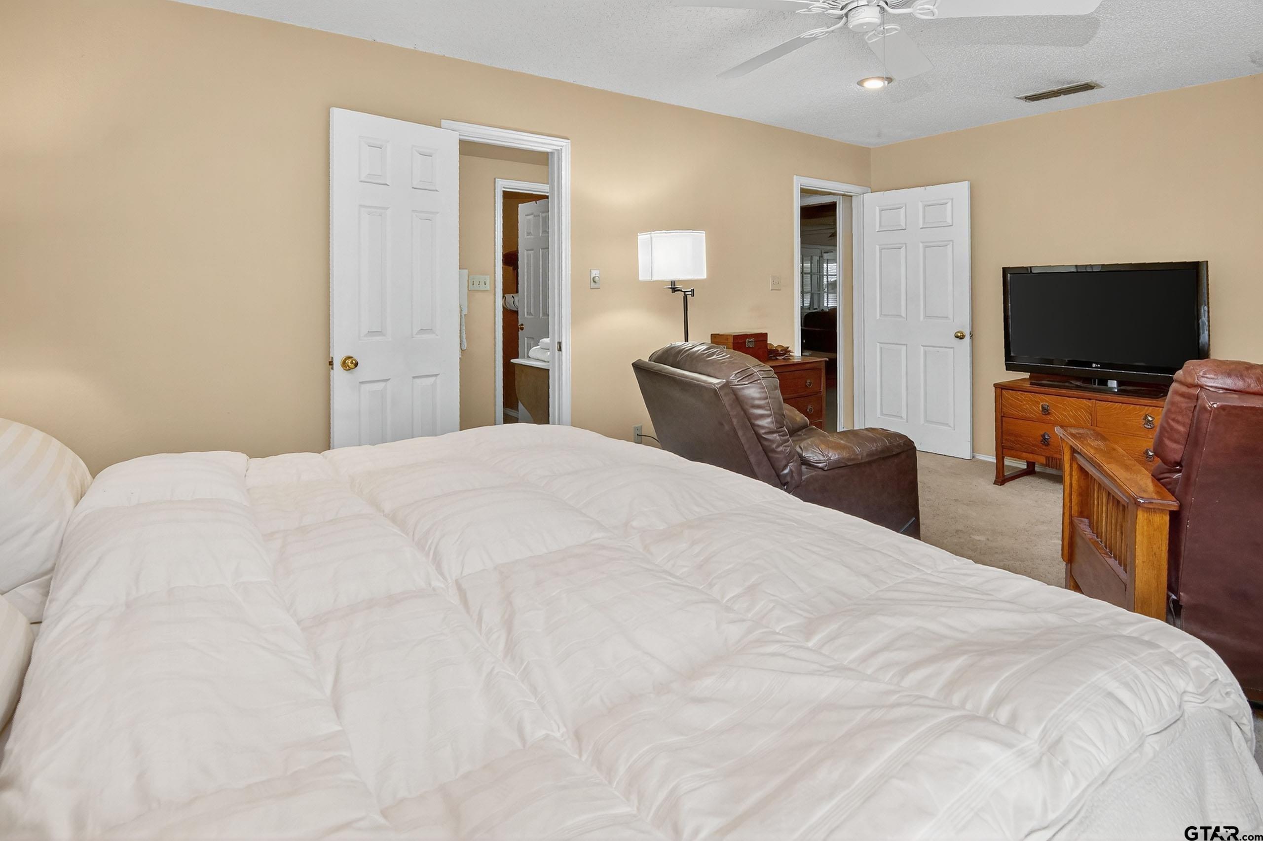 810 Jeanell Street Quitman, TX 75783 - Photo 21 of 37 a bedroom with a bed and a flat screen tv