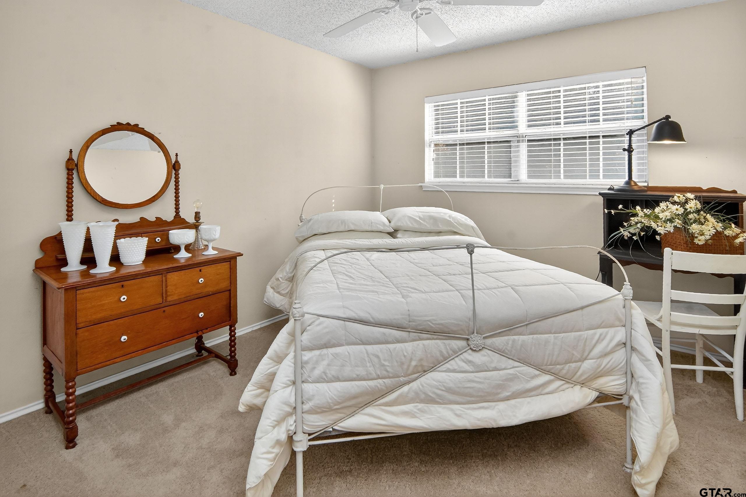 810 Jeanell Street Quitman, TX 75783 - Photo 25 of 37 a bedroom with a bed and a window