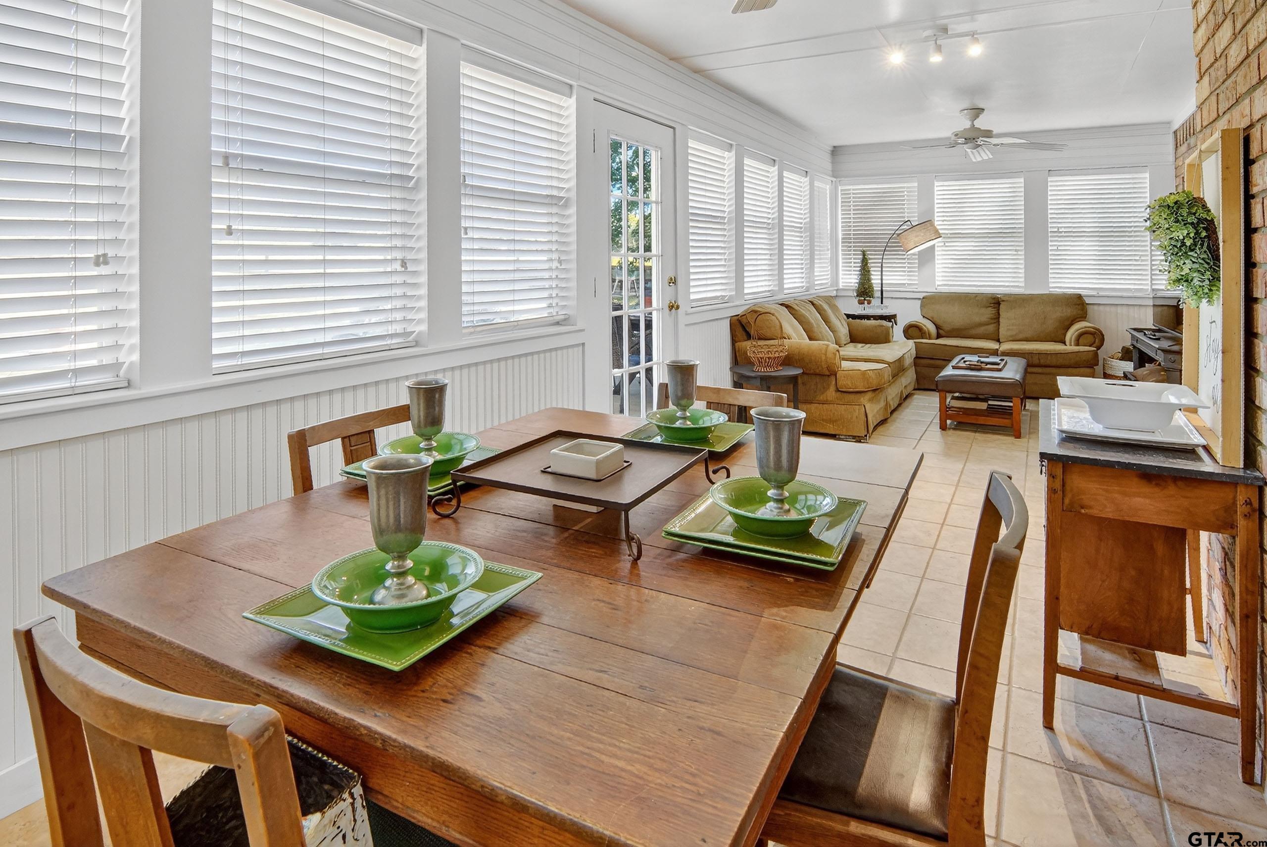 810 Jeanell Street Quitman, TX 75783 - Photo 29 of 37 a view of a dining room with furniture a potted plant and wooden floor