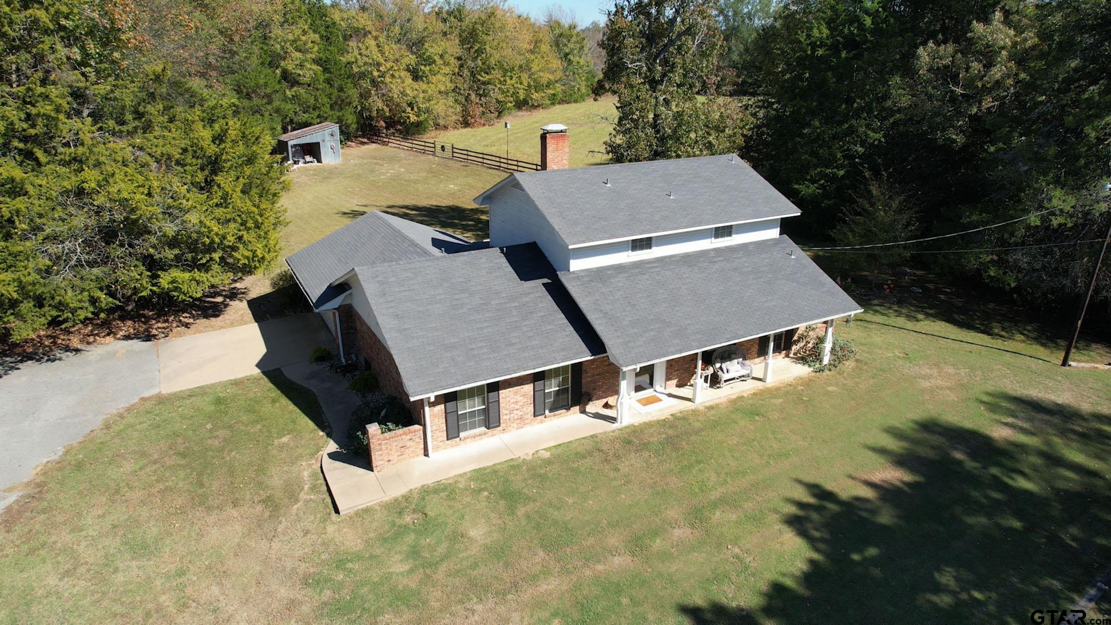 810 Jeanell Street Quitman, TX 75783 - Photo 34 of 37 an aerial view of a house with garden space and street view