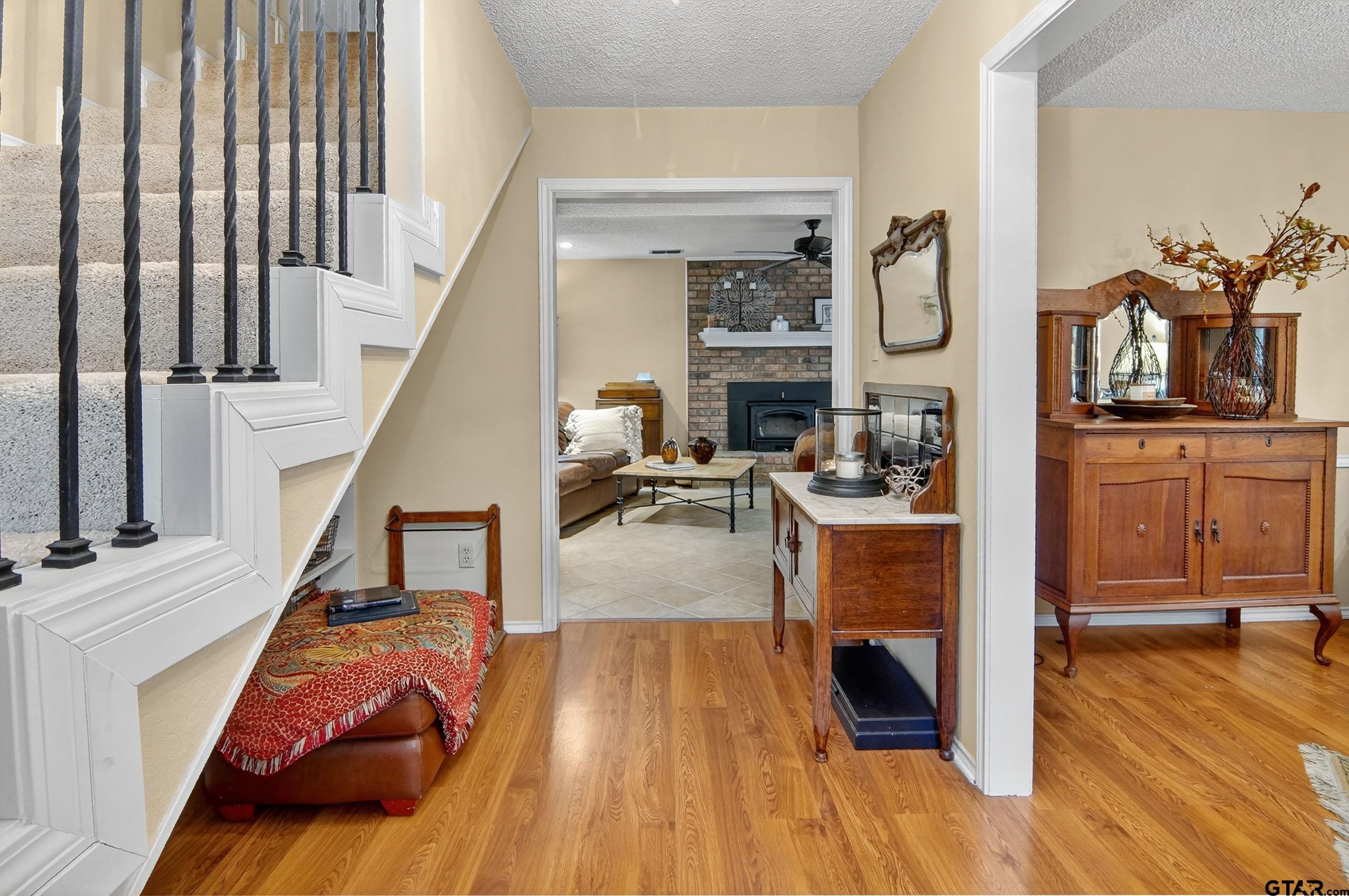 810 Jeanell Street Quitman, TX 75783 - Photo 9 of 37 a living room with furniture and a wooden floor