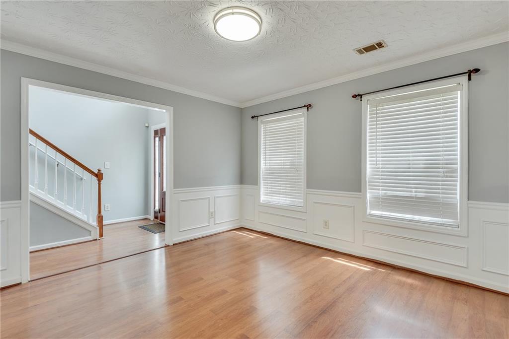 3337 Baymount Way Lawrenceville, GA 30043 - Photo 10 of 47 an empty room with wooden floor and windows