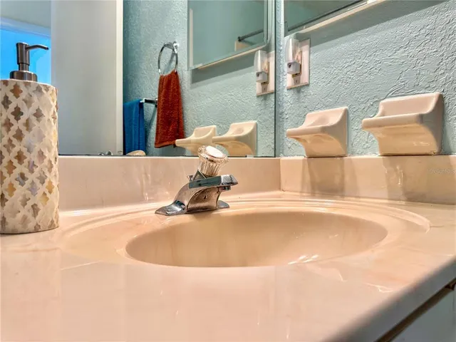 a bathroom with a tub and sink