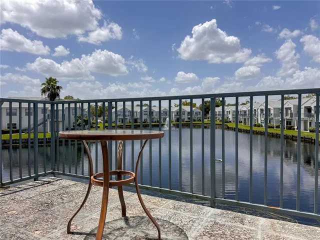 a balcony with wooden floor