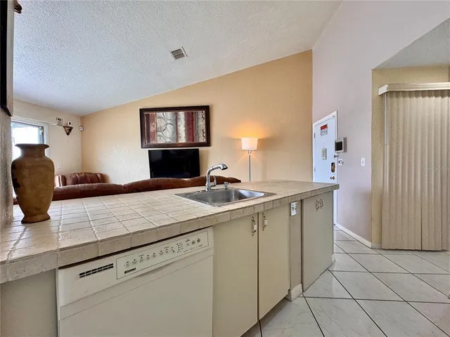 a view of living room with granite countertop furniture and sink