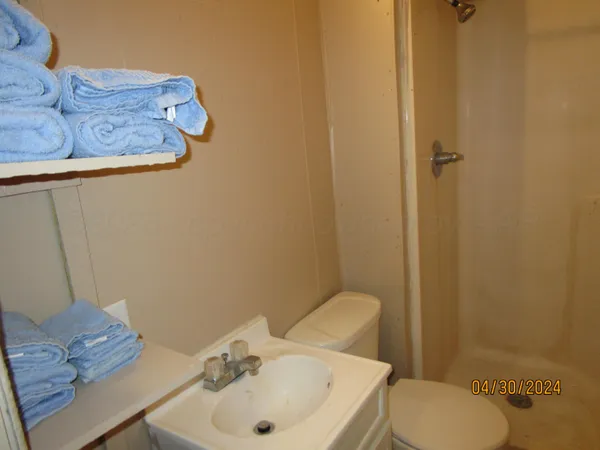 a bathroom with a sink and toilet