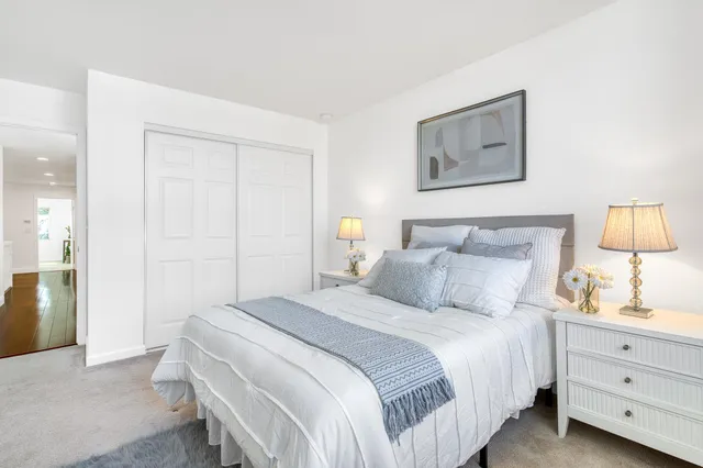 a bedroom with a bed and a night lamp