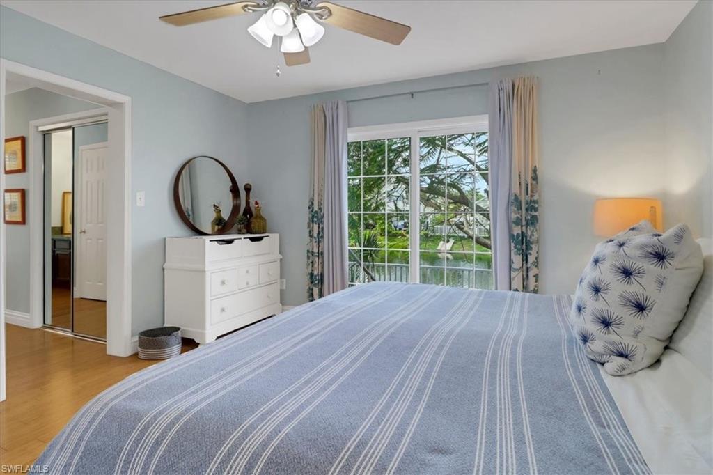 370 Leawood Circle Naples, FL 34104 - Photo 17 of 31 Bedroom with ceiling fan and light hardwood / wood-style flooring