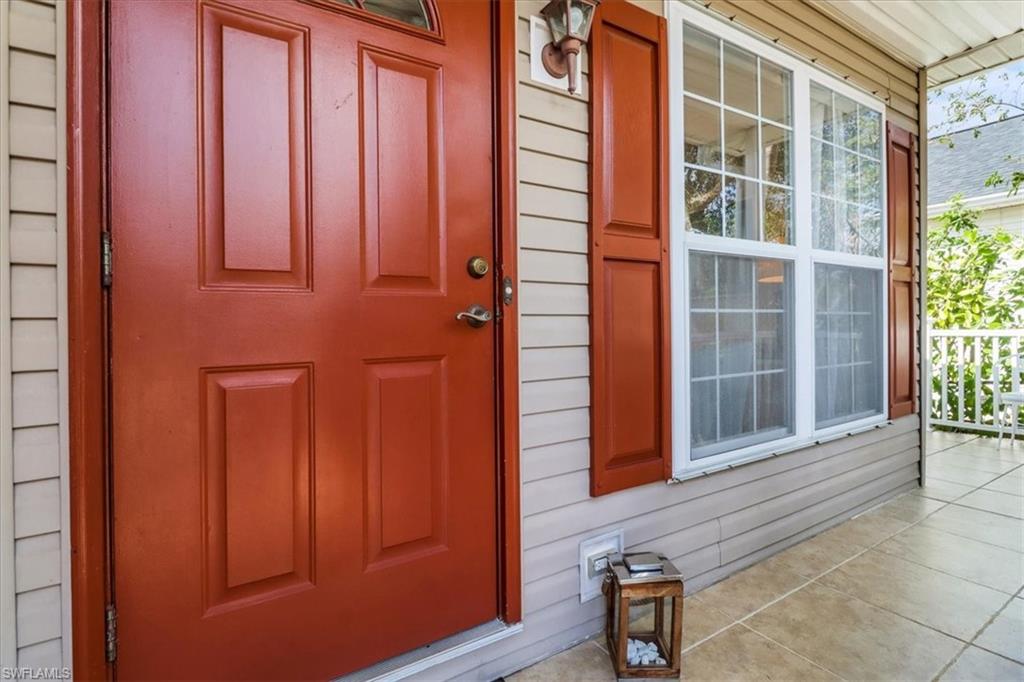 370 Leawood Circle Naples, FL 34104 - Photo 26 of 31 view of front door with outdoor space
