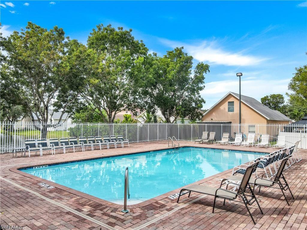 370 Leawood Circle Naples, FL 34104 - Photo 27 of 31 a view of a house with a yard and sitting area
