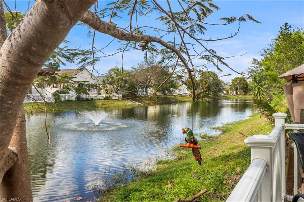370 Leawood Circle Naples, FL 34104 - Photo 3 of 31 a lake view with a sitting space and water view
