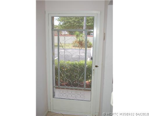 1901 Southwest Palm City Road, Unit 1C Stuart, FL 34994 - Photo 15 of 16 Exterior Front. Front Screen Door