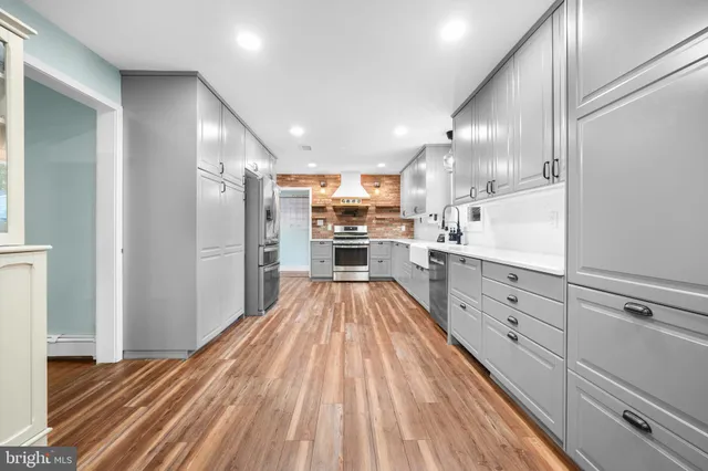 a view of a bathroom with wooden floor