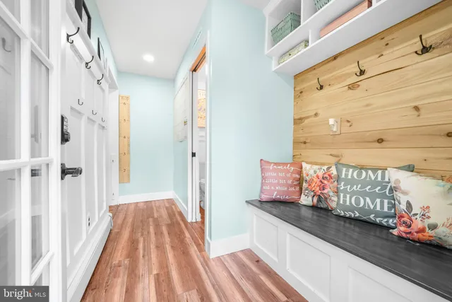 a bathroom with a toilet a sink and a mirror