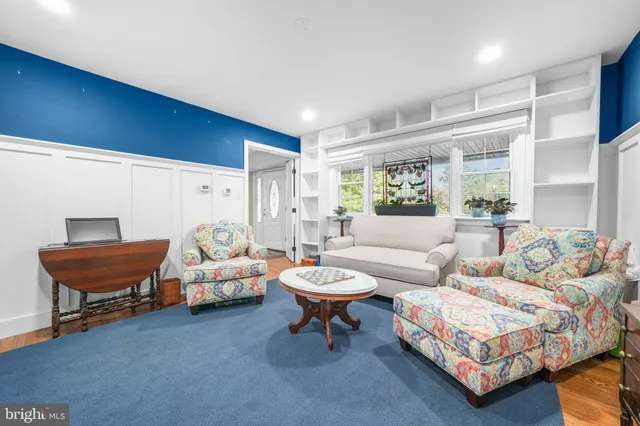 a view of a bedroom with wooden floor