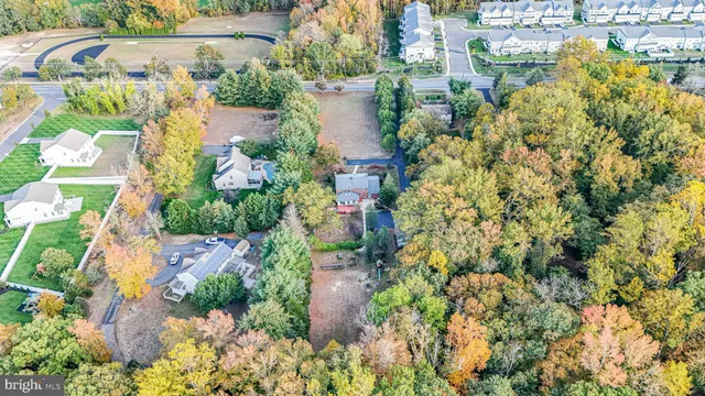 a aerial view of a house with a yard and garden space