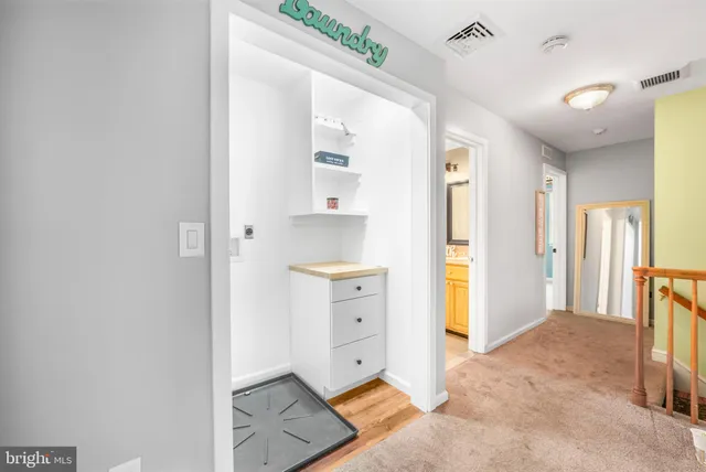 a view of a living room with a kitchen