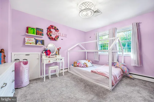 a view of a kitchen with play room and toys