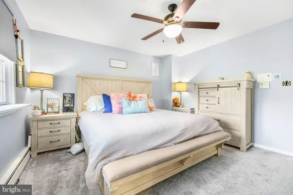 a view of a house with a yard and pathway