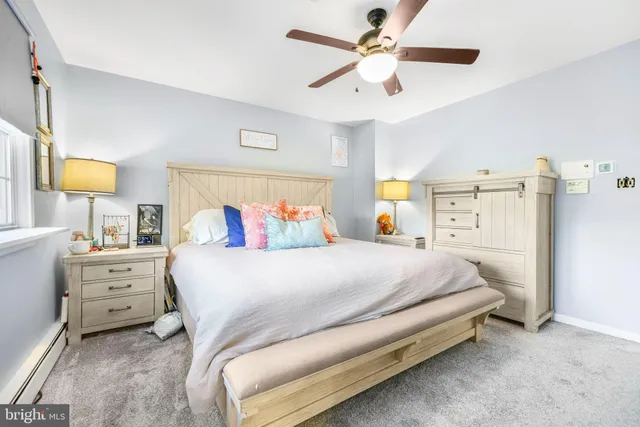 a view of a house with a yard and pathway