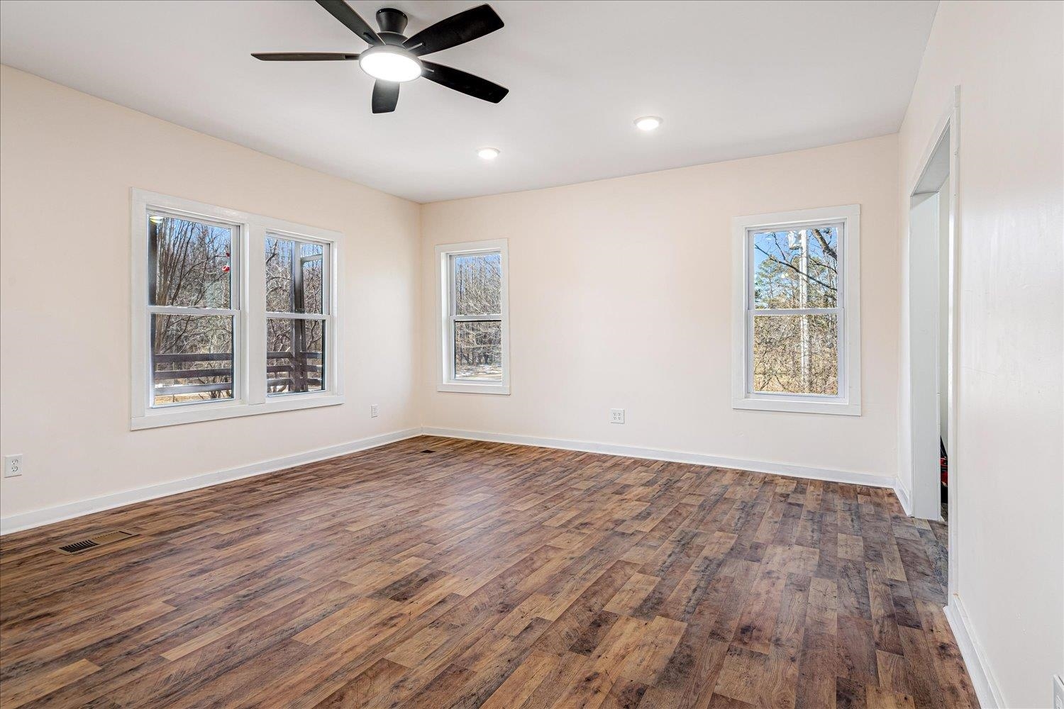 245 Ecology Loop Eads, TN 38028 - Photo 11 of 23 a view of an empty room with window and wooden floor