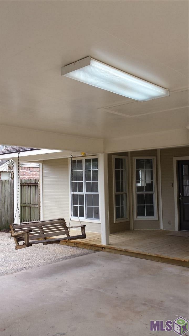 13475 Parwood Avenue Baton Rouge, LA 70816 - Photo 6 of 7 Back porch and swing