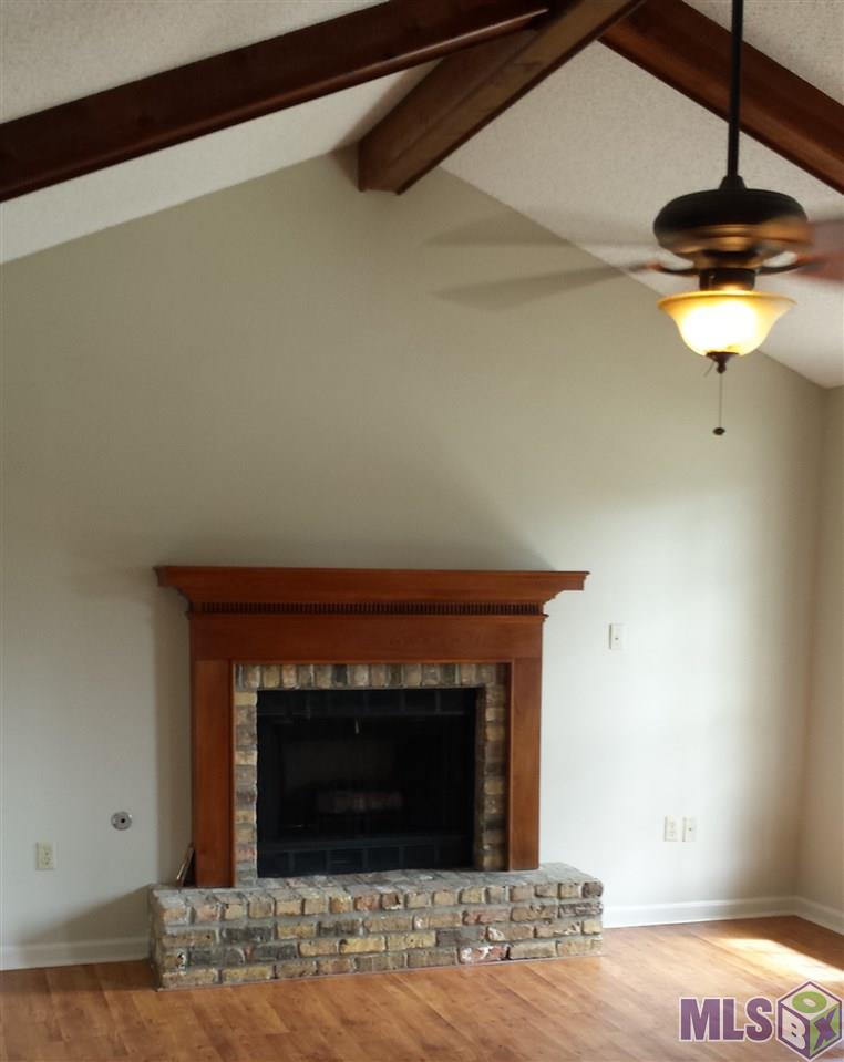 13475 Parwood Avenue Baton Rouge, LA 70816 - Photo 7 of 7 Fireplace and Vaulted ceilings