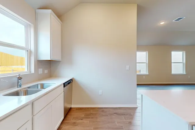 a kitchen with a stove and a microwave