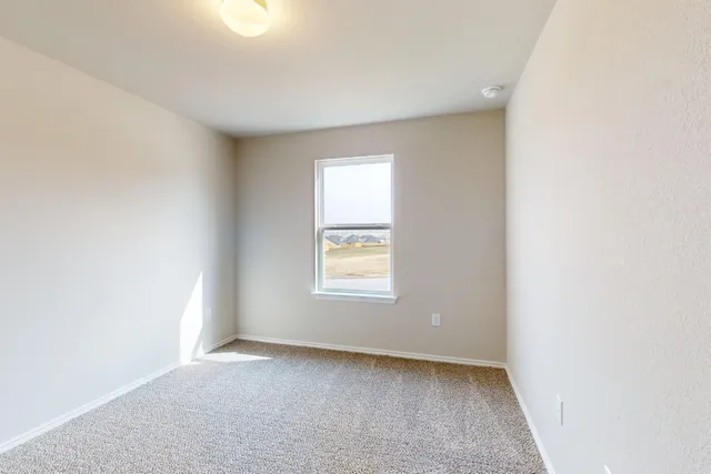 a bathroom with a toilet and a bath tub